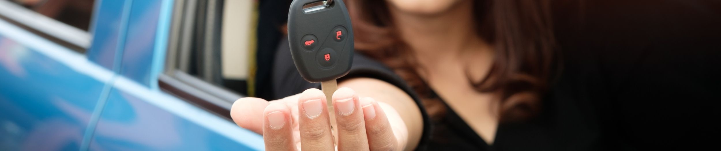Women being handed car keys