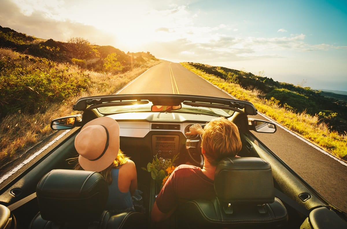 Couple driving on road