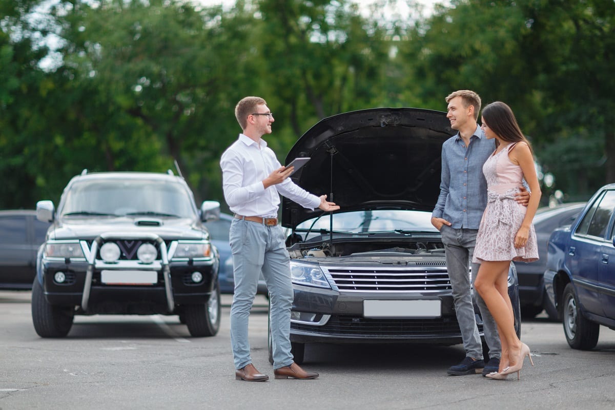 Couple at car dealership