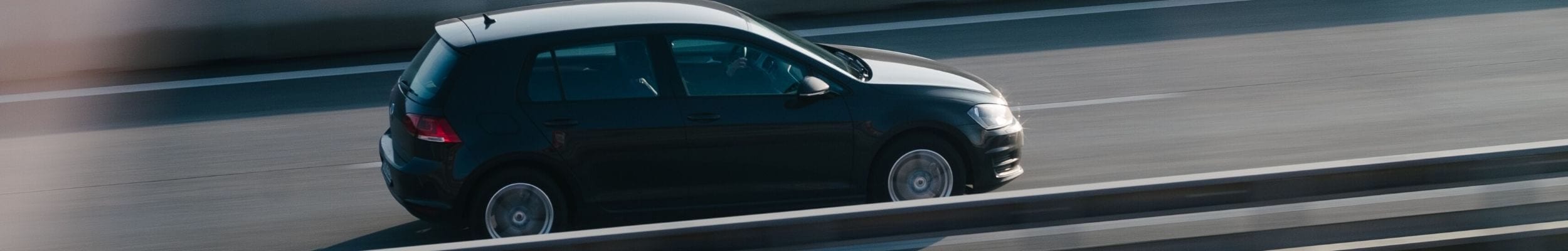 Car driving down motorway