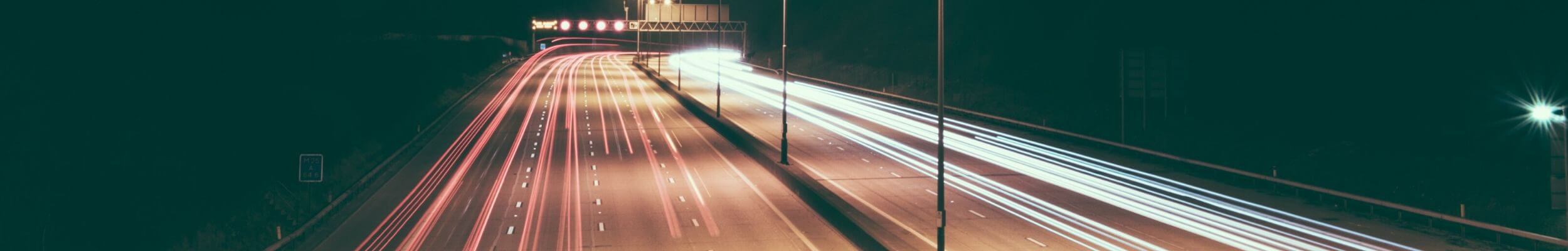 Motorway at night with car trails