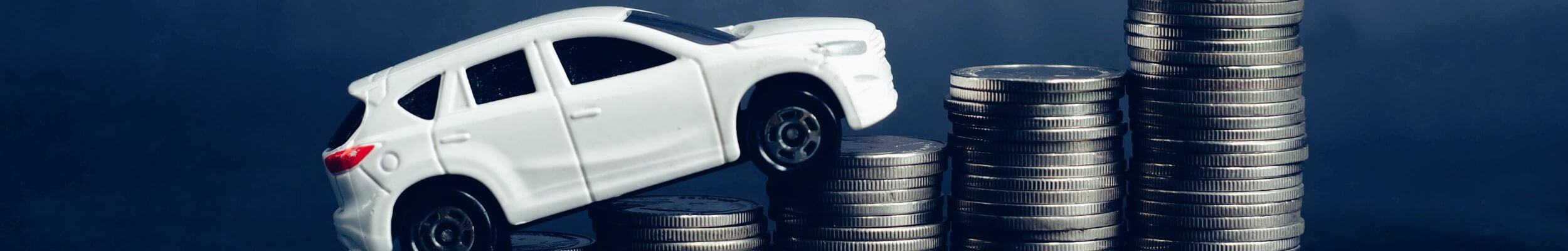 Car driving over money