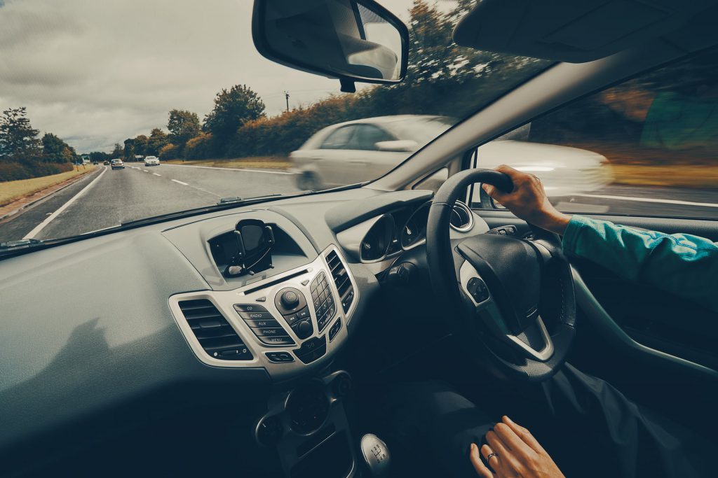 image of car being driven on the road