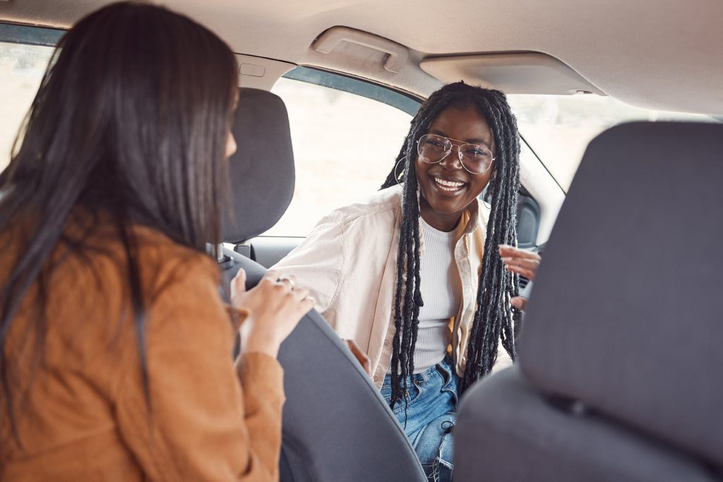 Friends talk in the car