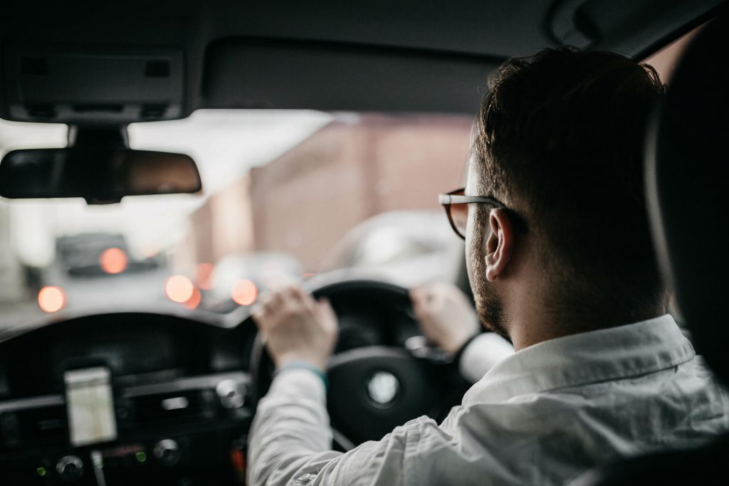 shirted man driving