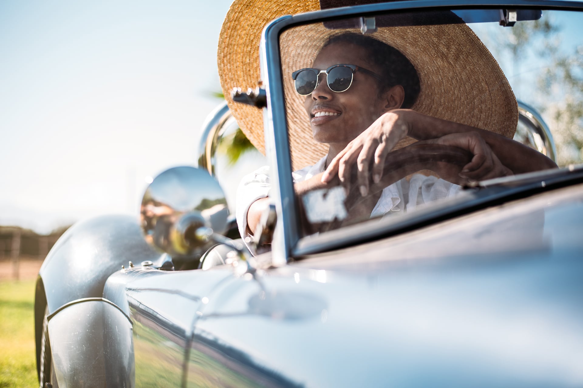 image of woman in a classic car