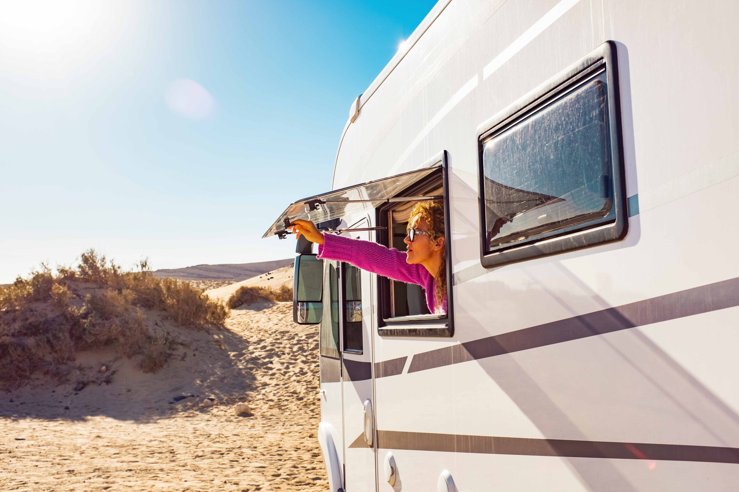 Woman opening camper van window