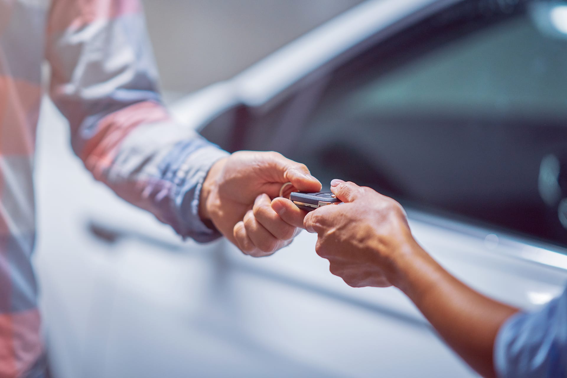 Handing over car keys.