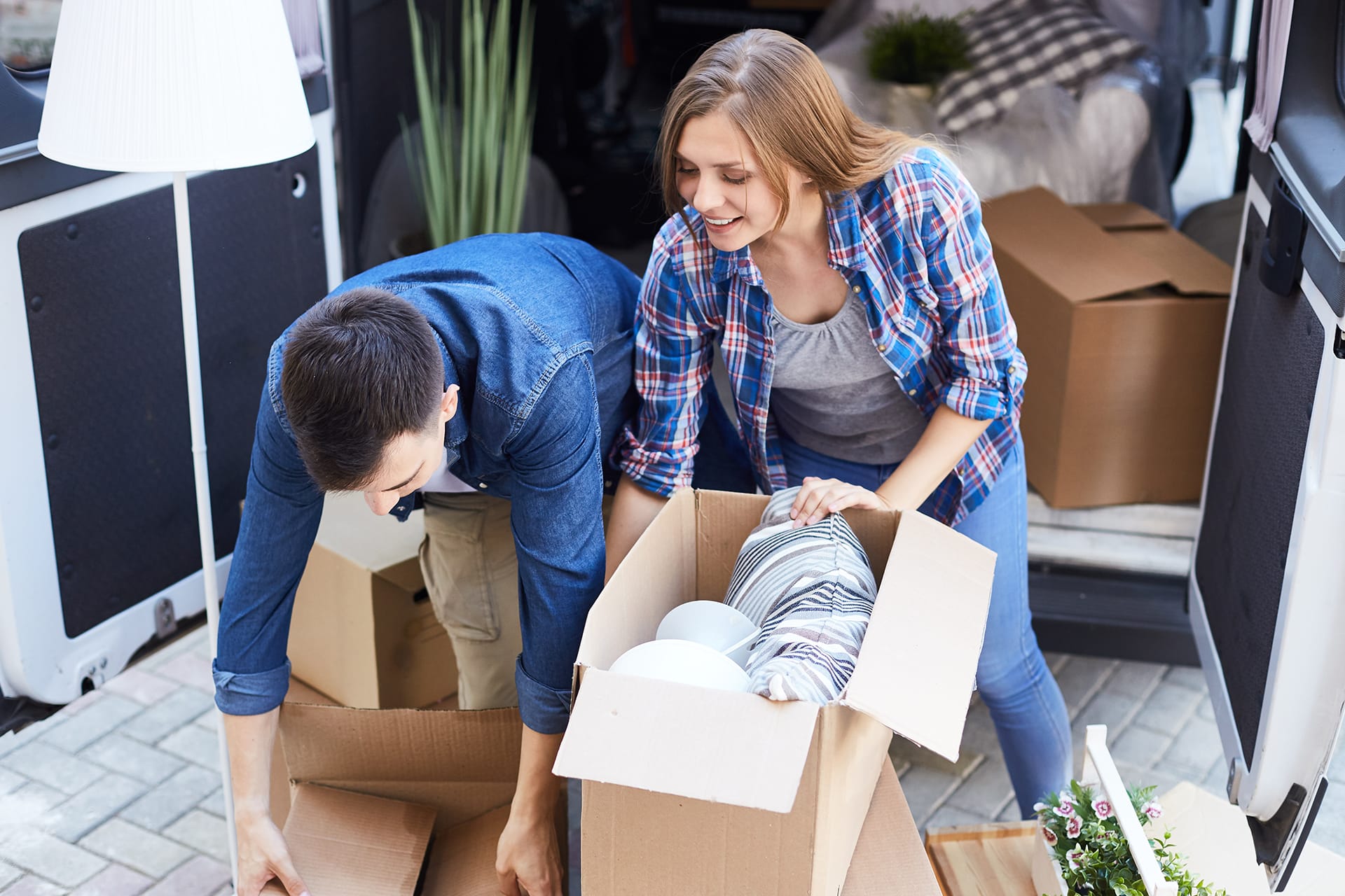 Couple moving house using a van
