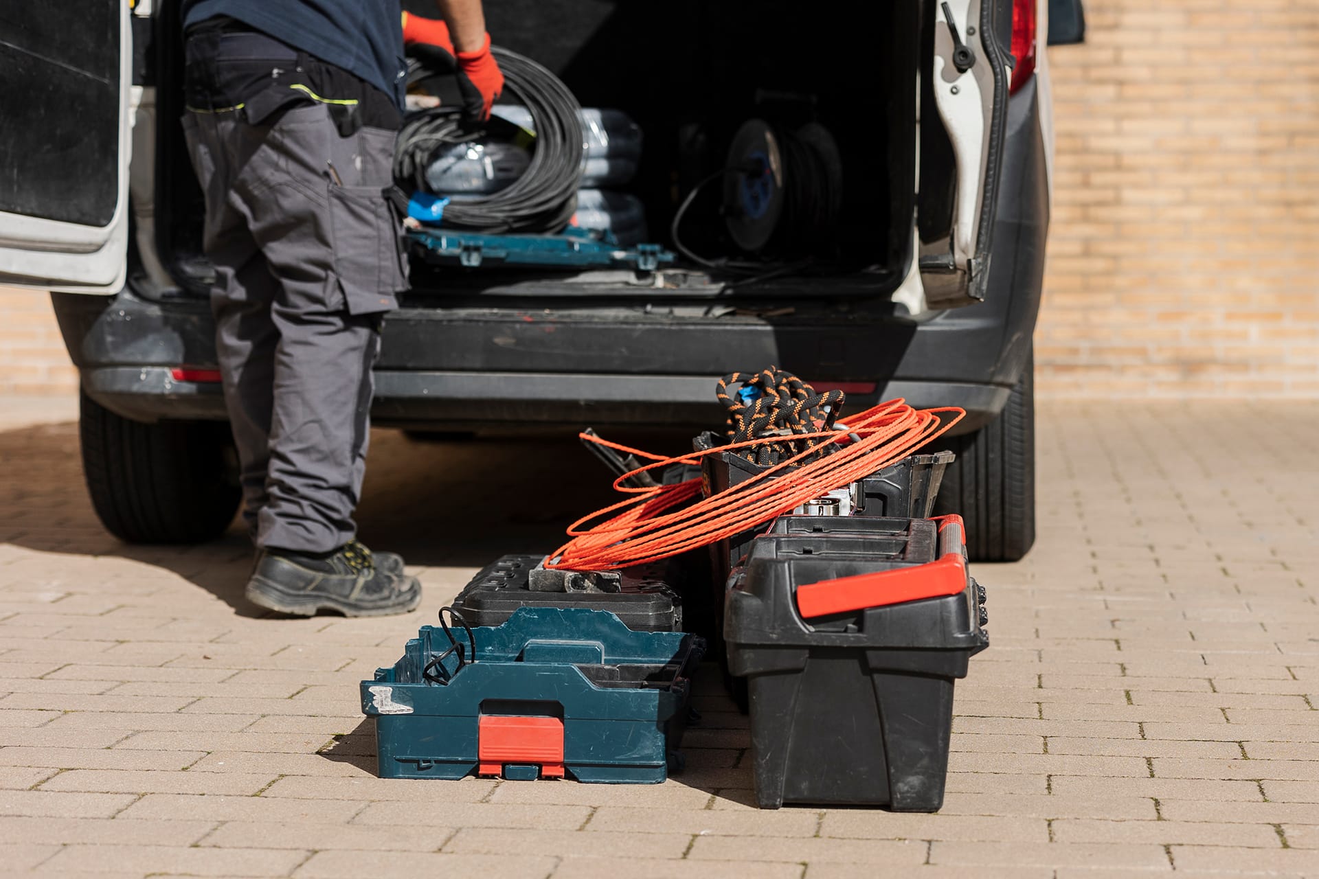 Tradesperson packing van up